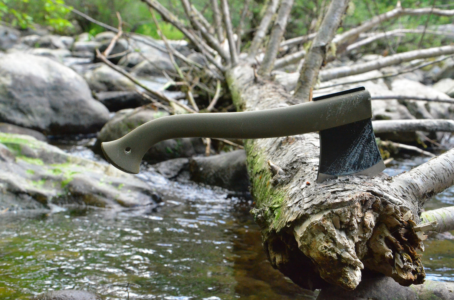 Morakniv axe stuck in log on the water