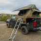Vagabond Lite Rooftop Tent in Forest Green Hyper Orange with telescopic ladder shown on a truck