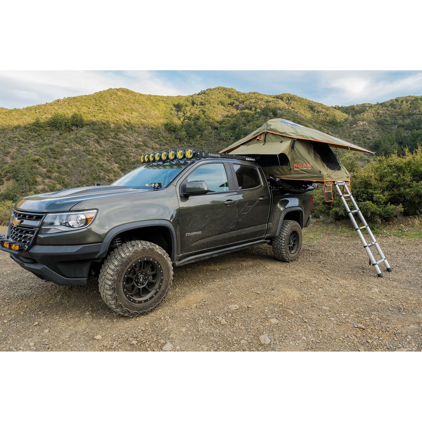 Vagabond Lite Rooftop Tent in Forest Green Hyper Orange on a Chevy Colorado Truck