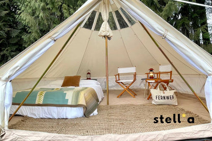 Interior view of Stella glamping tent with furnished setup