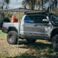 Rooftop awning attached to roof rails on a Toyota Tacoma truck